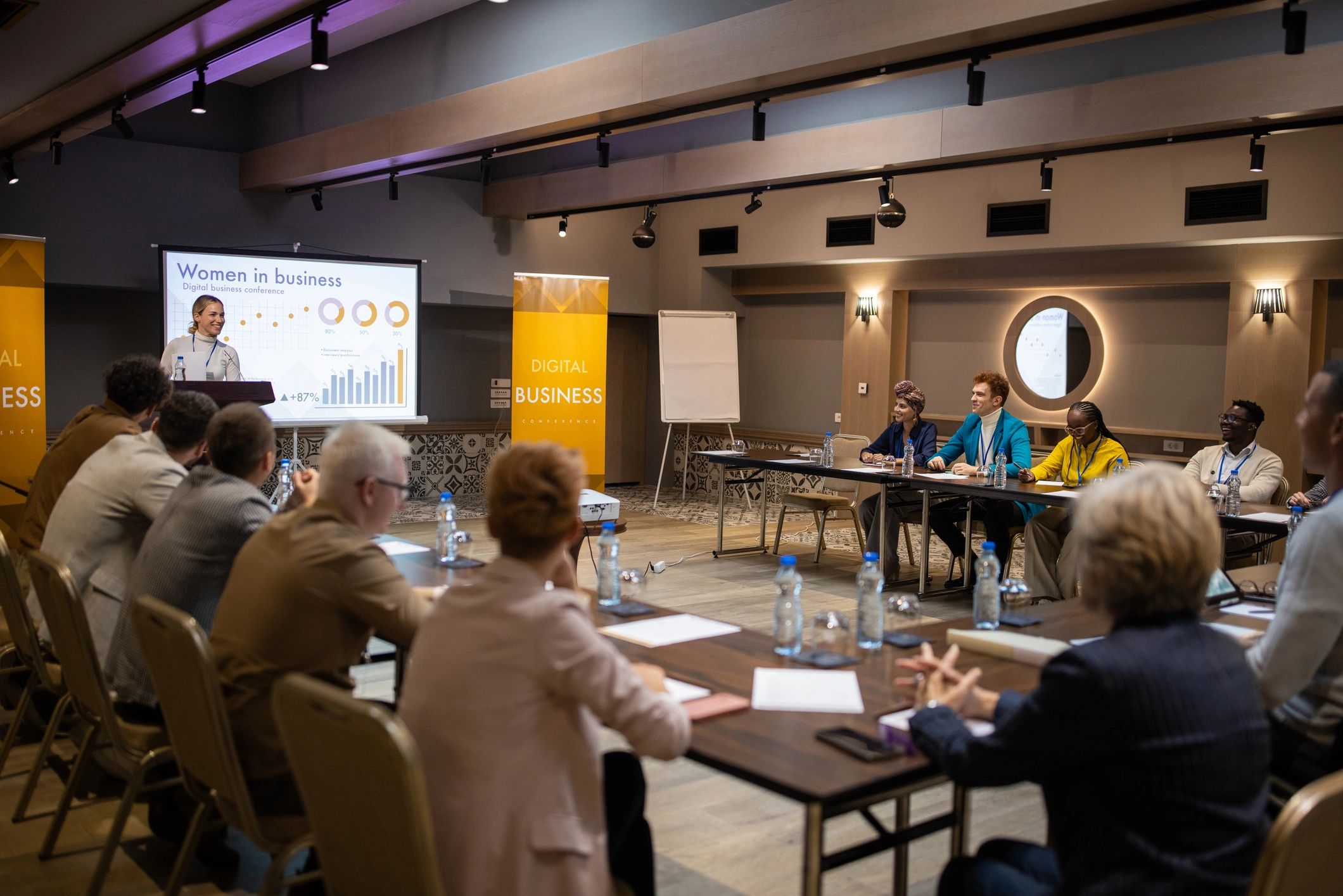 Audience listening to a speaker at a business event
