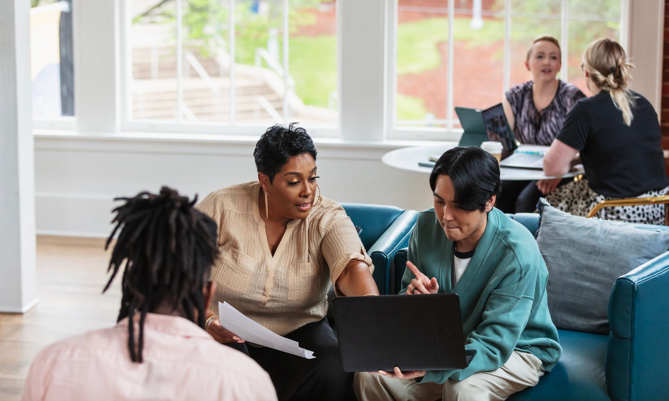 Local professionals in conversation during a business meeting