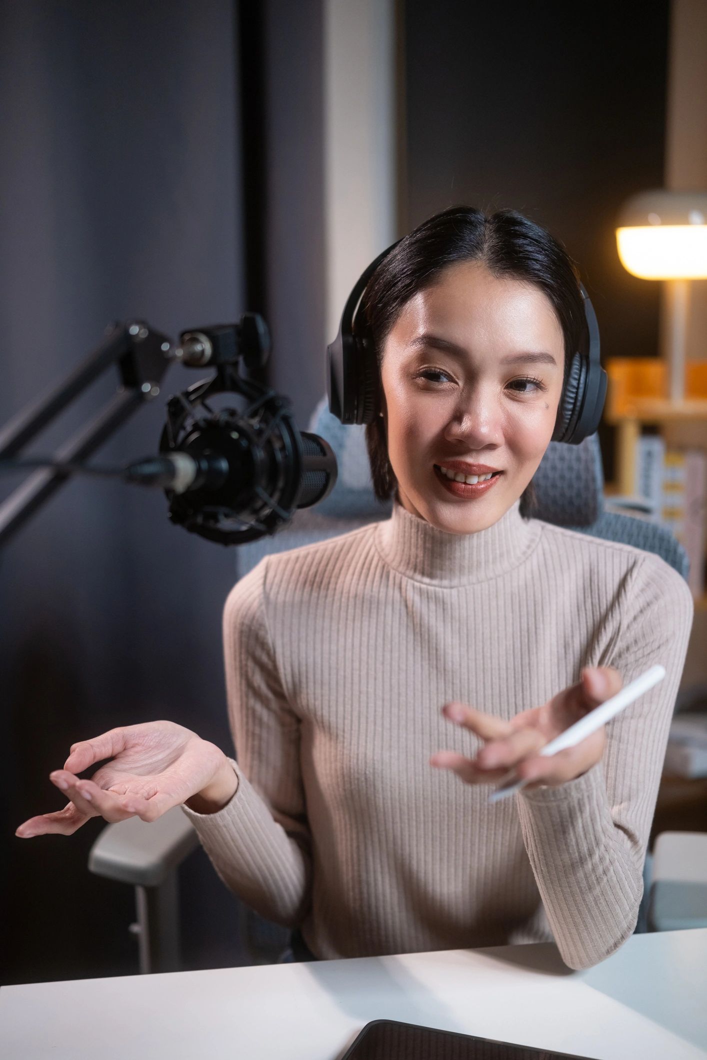 Podcast host speaking into a microphone