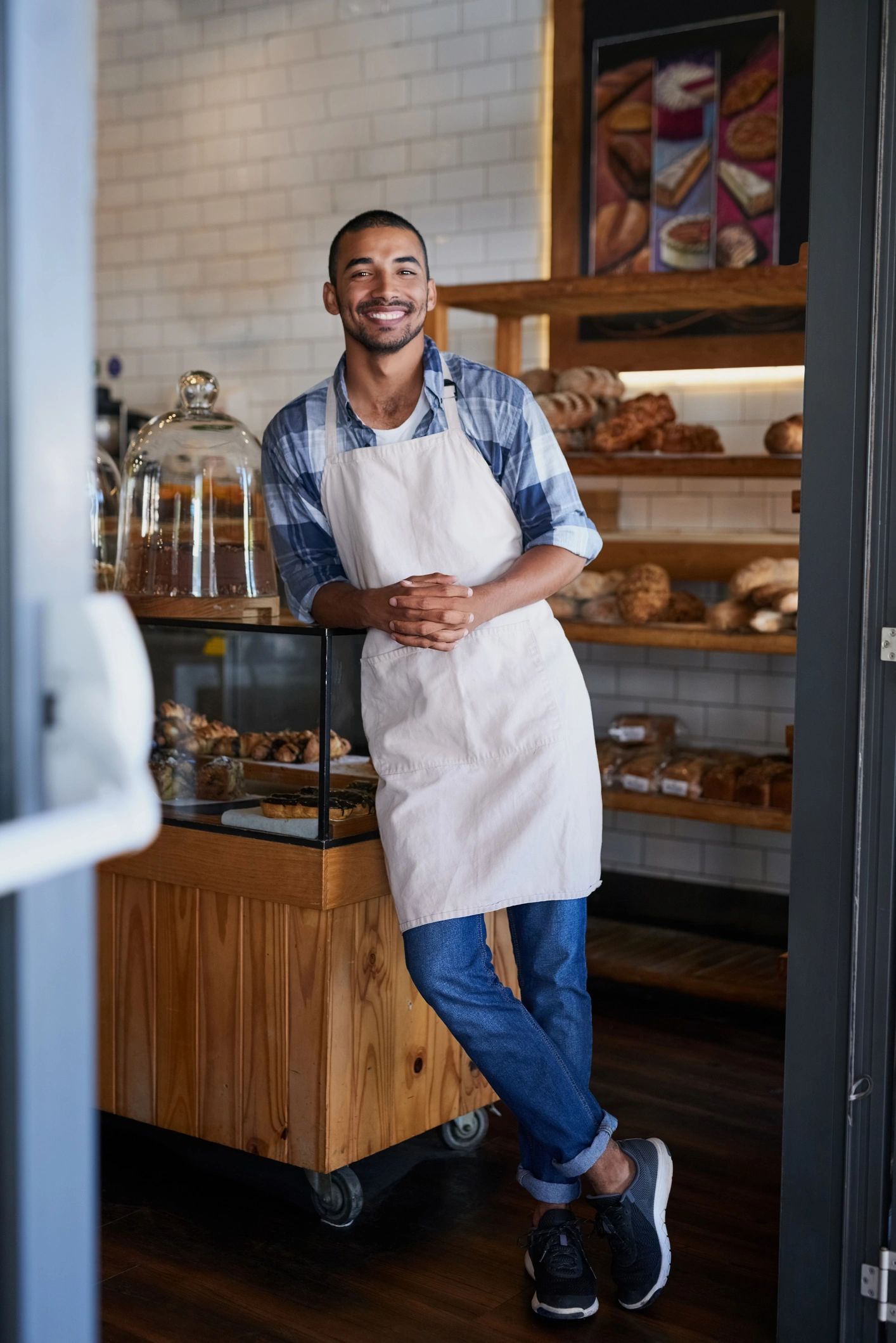 Portrait of a bakery owner in his shop